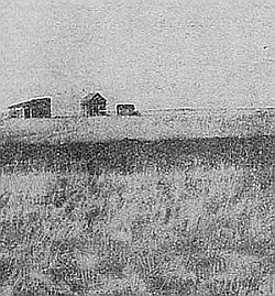 Beginning a home in the prairie—house and table "lands"
are built on cement foundation.