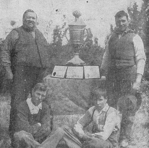 Mr. J. C. Hill & Sons, of Lloydminster, Saskatchewan, who
recently became winners for the third time of the Colorado Silver
Trophy, valued at $1500 for best peck of oats in the world. They now own
the trophy.