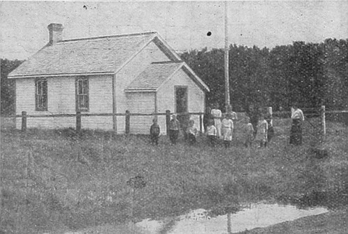 Typical school in rural district in Western Canada, which
will soon be replaced by consolidated school, picture of which appears
elsewhere.