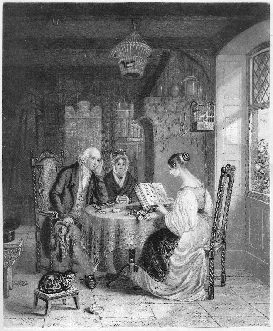 a young woman and an older woman and man sit at a small round table as the young woman reads from a bible