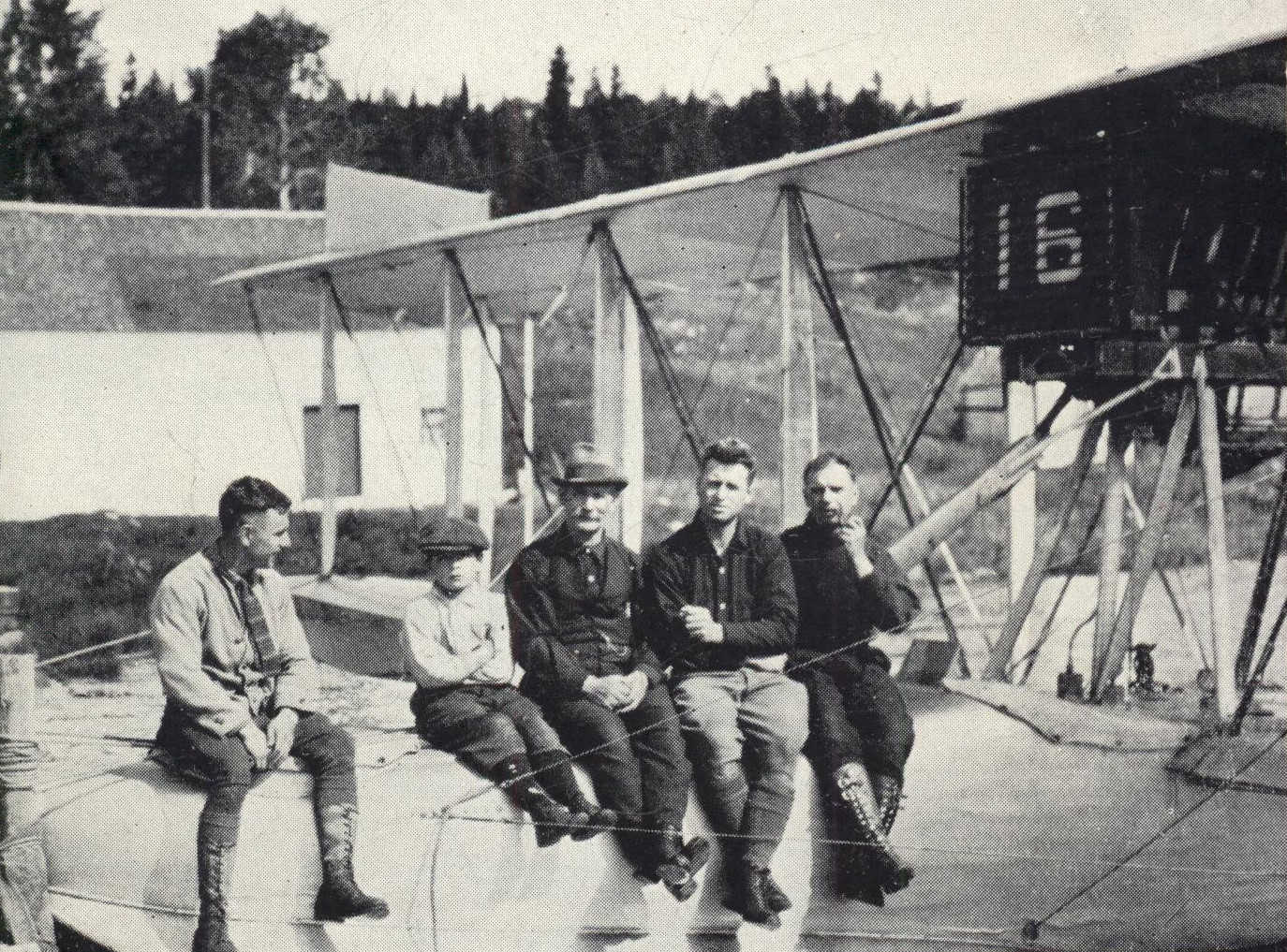 Group of men sitting on flying boat