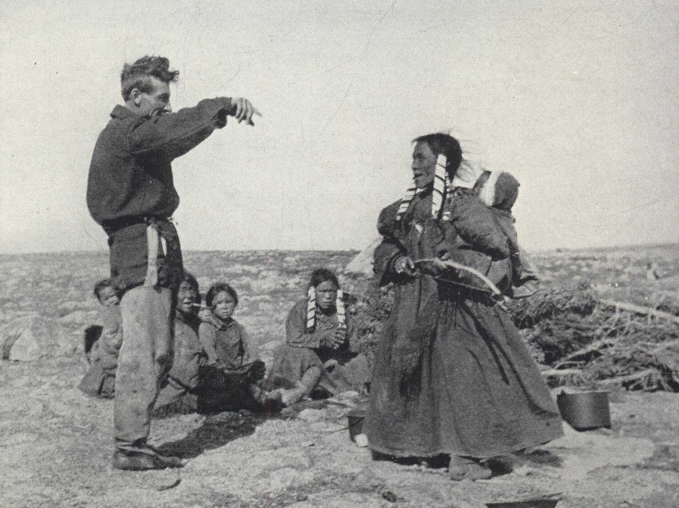 Man talking with group of Inuit