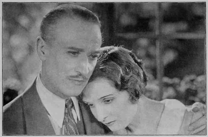 Sad woman with head on shoulder of man