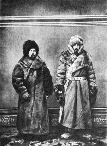 Alliani and Talbot posing in fur coats, hats and boots
