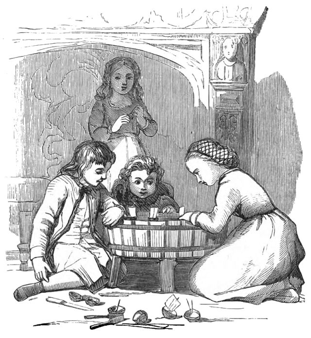 Four children sitting around a wooden tub in which small toy boats are floating