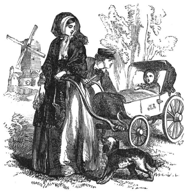 A man is looking at a child in a carriage while a woman holds the carriage handle and a dog is standing close by