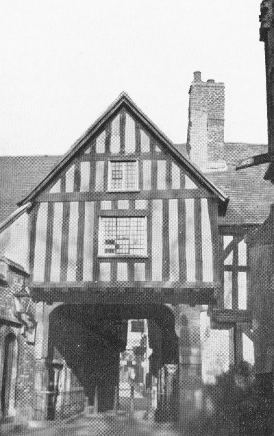 Gabled building over one lane walking street entry