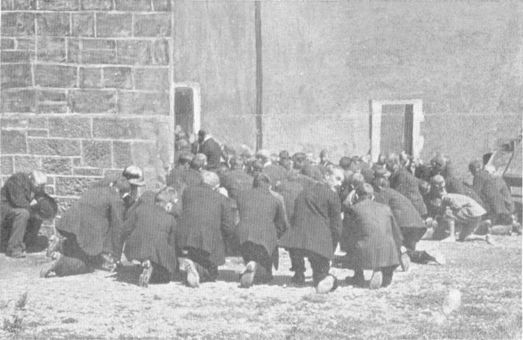 people kneeling outside a church