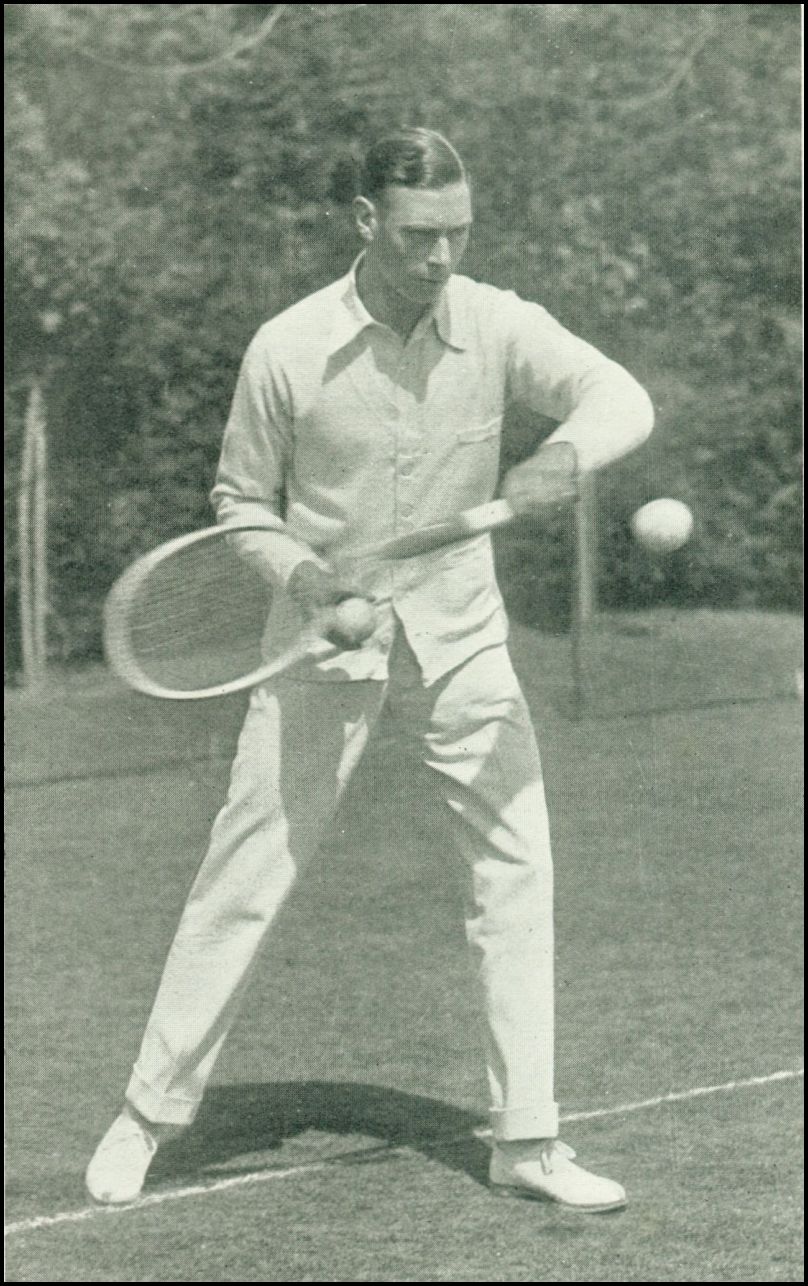 A man dressed in tennis whites is preparing to hit an incoming ball with his tennis racket.