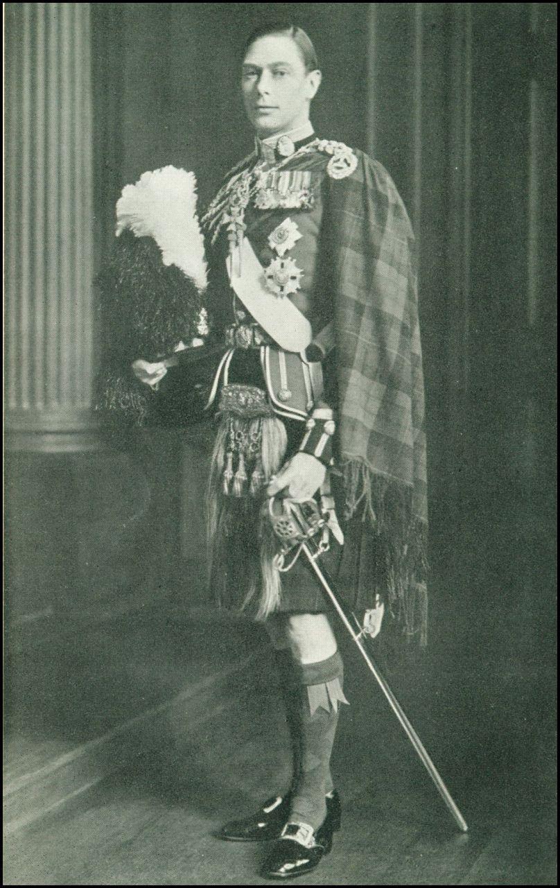 A photo of King George in full offical royal regalia which is covered in medals and symbols of office.