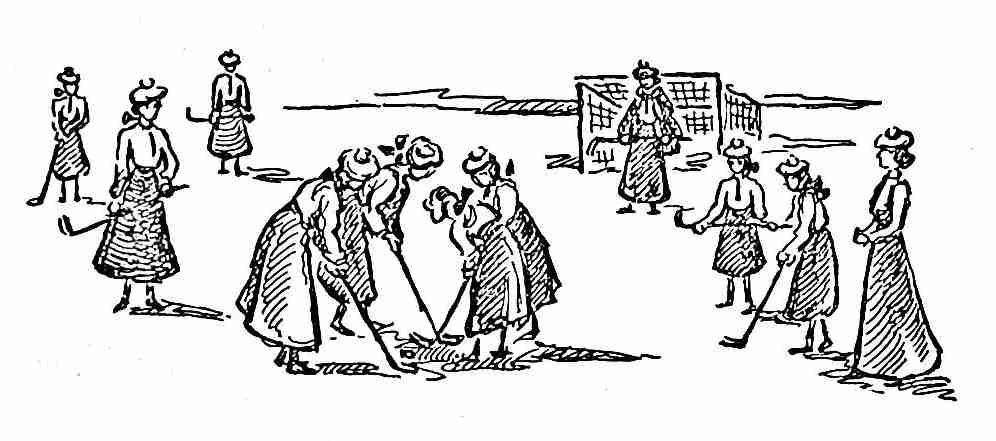 Girls playing field hockey