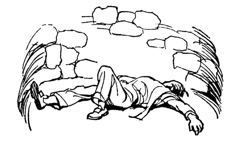 Young boy lying at bottom of well