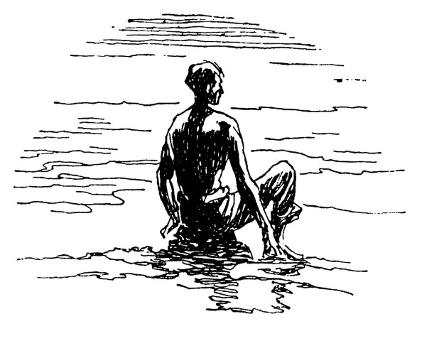 Young boy at water's edge