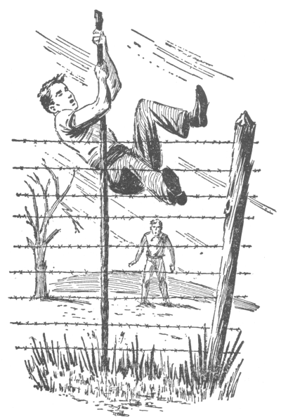 Joe pole vaulting half way over a barbed-wire electric fence