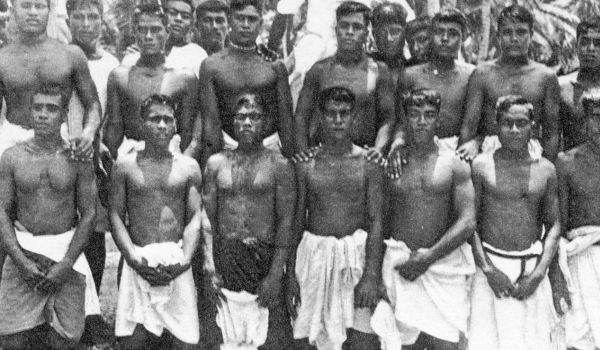 two rows of young men standing posing for picture