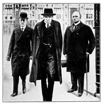 3 men walking forward with scowls on their faces