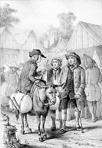 Un homme assis sur une petite vache à cornes parle à deux hommes sur la place d’un village.