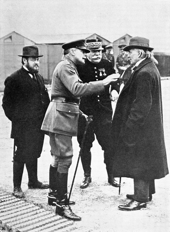 military and civilian gentlemen in a discussion