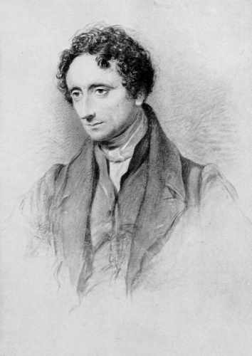 portrait of man with curly hair, sharp nose, looking down to right