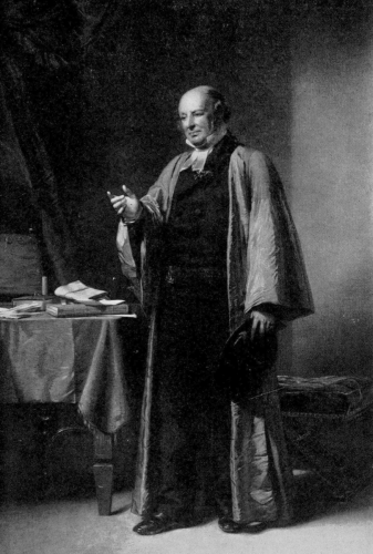 portrait of Robert Inglis standing and wearing long gown over suit with right hand extended
