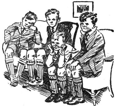 the four Outlaw boys sitting in a row with bored and exasperated looks