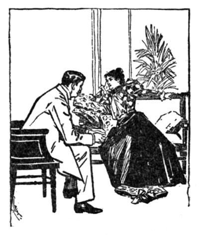 young man seated talking to seated woman