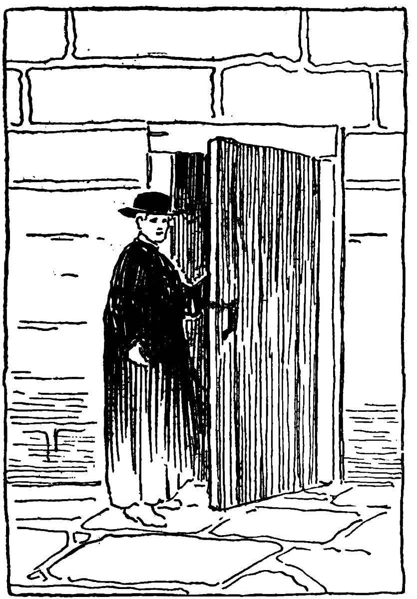 M’sieur le Curé wearing a hat standing in front of a door held open