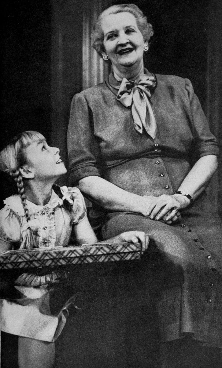 Rhoda in pigtails looking up to her aunt Monica