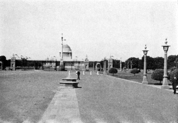 broad lawn before palace-like building
