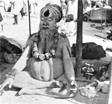 Indian man sitting cross-legged