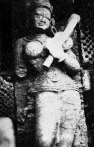 stone figure on side of building