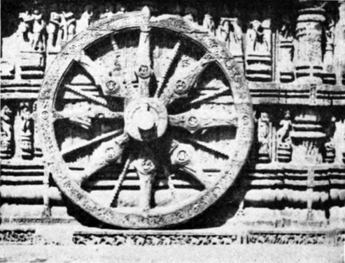 stone wheel on side of building