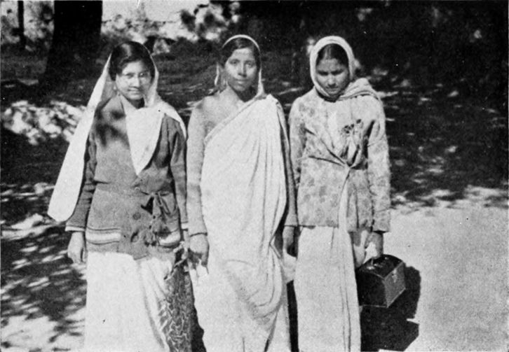 three women in long dresses
