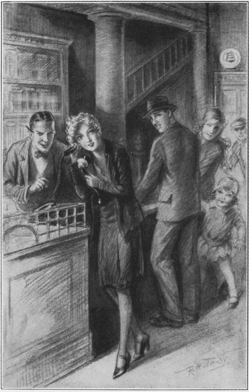Nancy at the Clerk’s desk, using the phone.