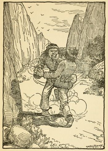 Indian boy fighting with Indian man inside canyon