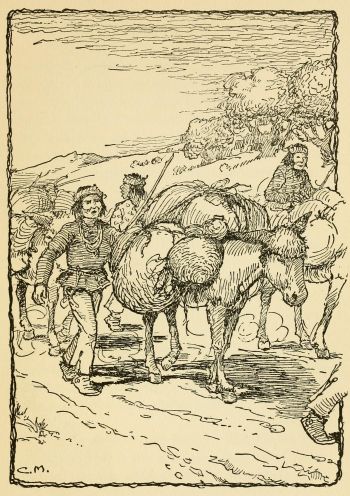 Indians walking heavily-loaded burros