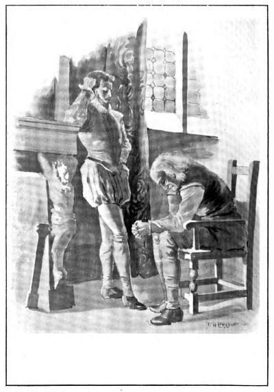 standing man talking to a seated older man who is leaning forward on his knees looking at the floor