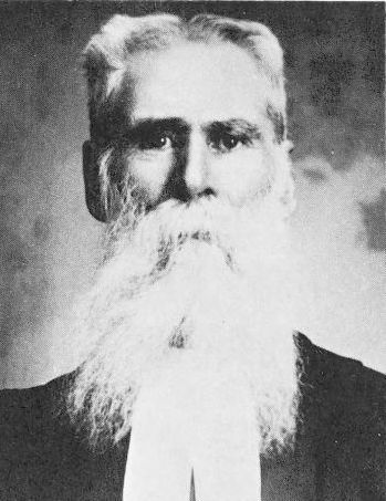 frontal view of white haired man with long white beard