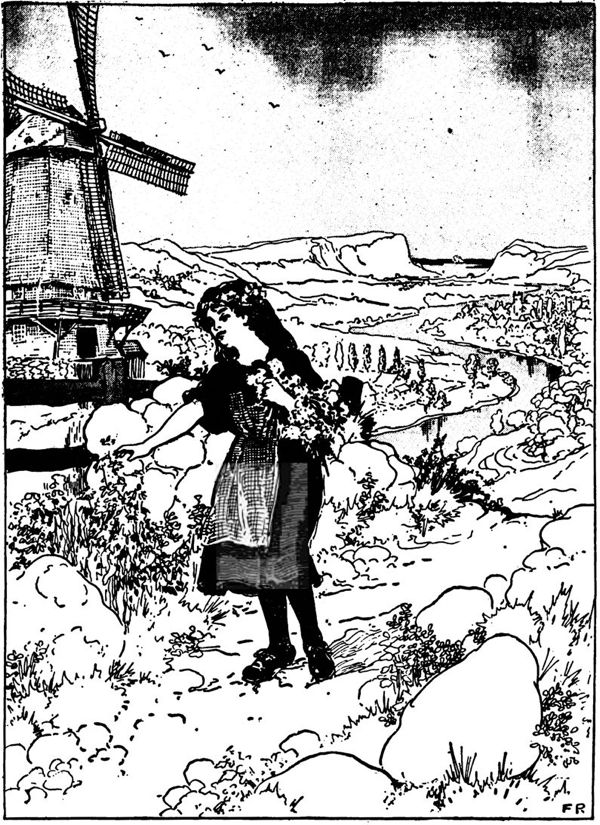 a girl picking flowers near a windmill