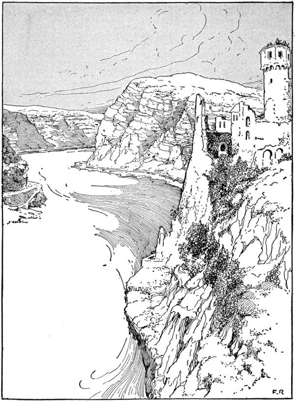a ruined castle sits high above the cliffs by a large river