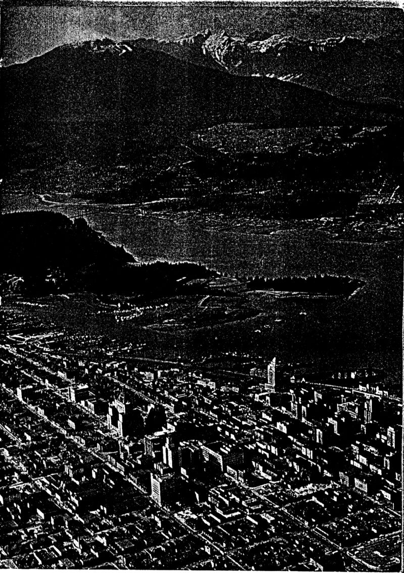 Vancouver from the air, in front of the mountains