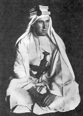 Lawrence seated in his white arab robe