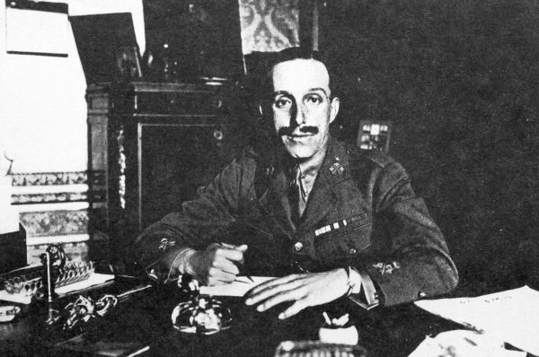 Alfonso in uniform at his desk