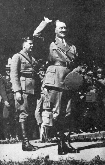 Hitler in uniform giving the wave