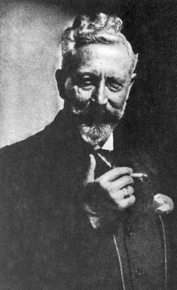 bearded man holding a cigarette