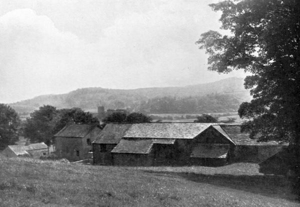 farmhouse with hills behind