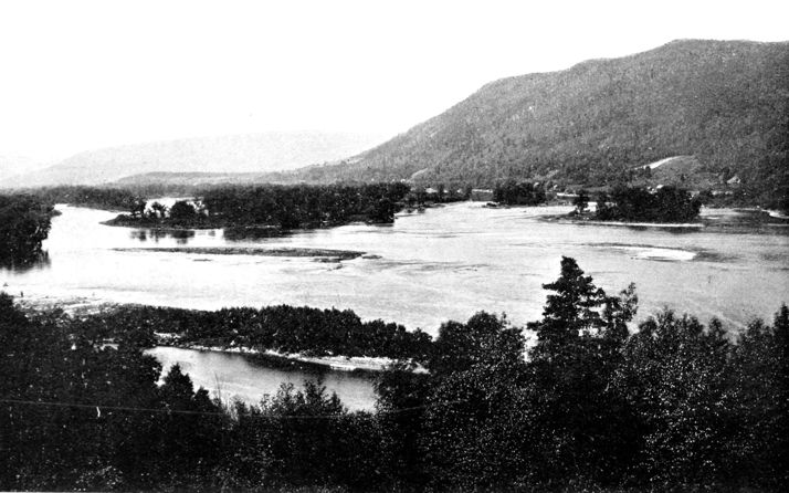 river with large hill behind