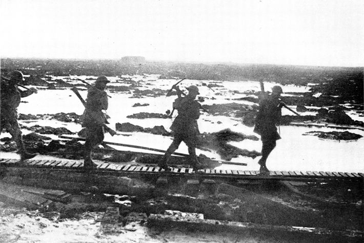 soldiers walking on a boardwalk