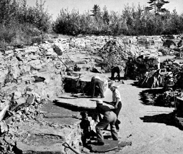 men working in sandstone quarry