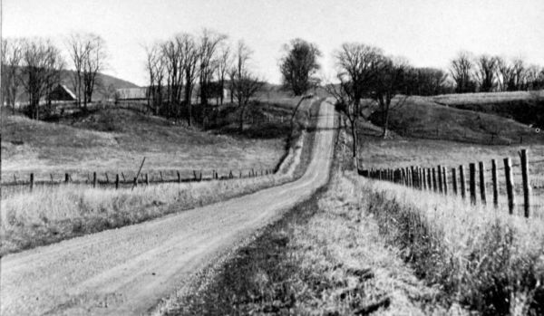straight road climbing over a hill